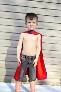 little boy with cape