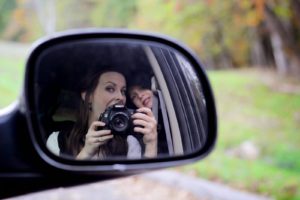 selfie in the side mirror of car