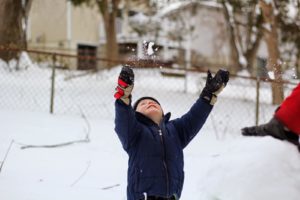 boy playing in snow