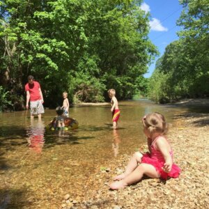 large family at creek