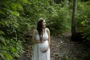 woman in white dress by trees