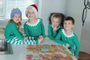 kids looking at christmas cookies